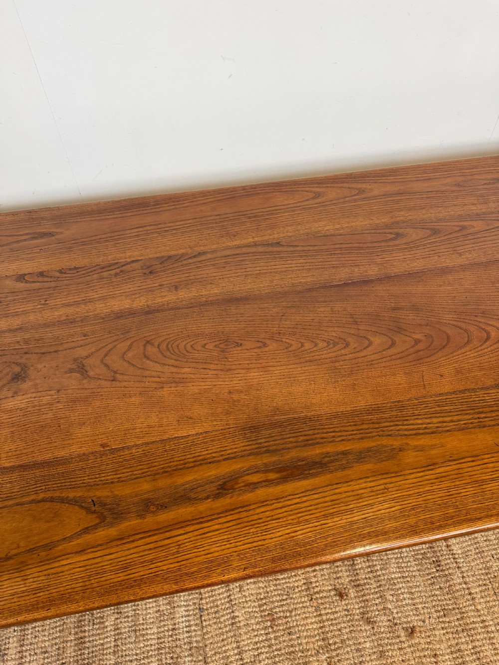 A rectangular late 19th-century chestnut farmhouse table featuring a plank top and four straight tapered legs. View IV