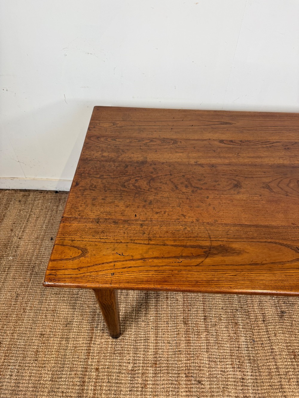 A rectangular late 19th-century chestnut farmhouse table featuring a plank top and four straight tapered legs. View V