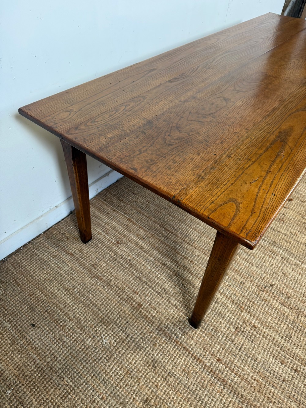 A rectangular late 19th-century chestnut farmhouse table featuring a plank top and four straight tapered legs. View VI