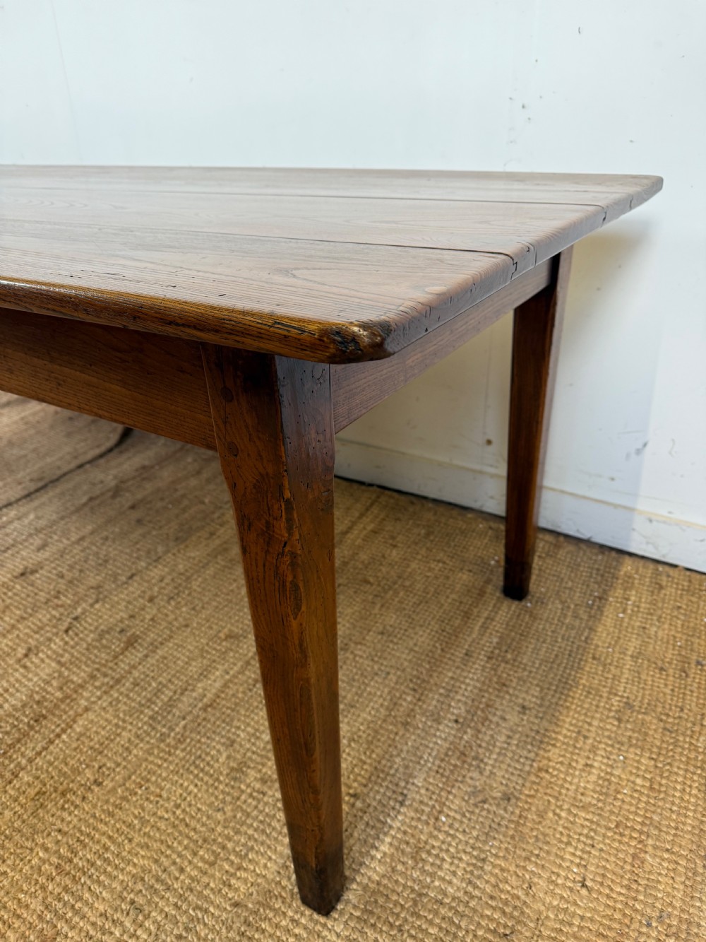 A rectangular late 19th-century chestnut farmhouse table featuring a plank top and four straight tapered legs. View VIII