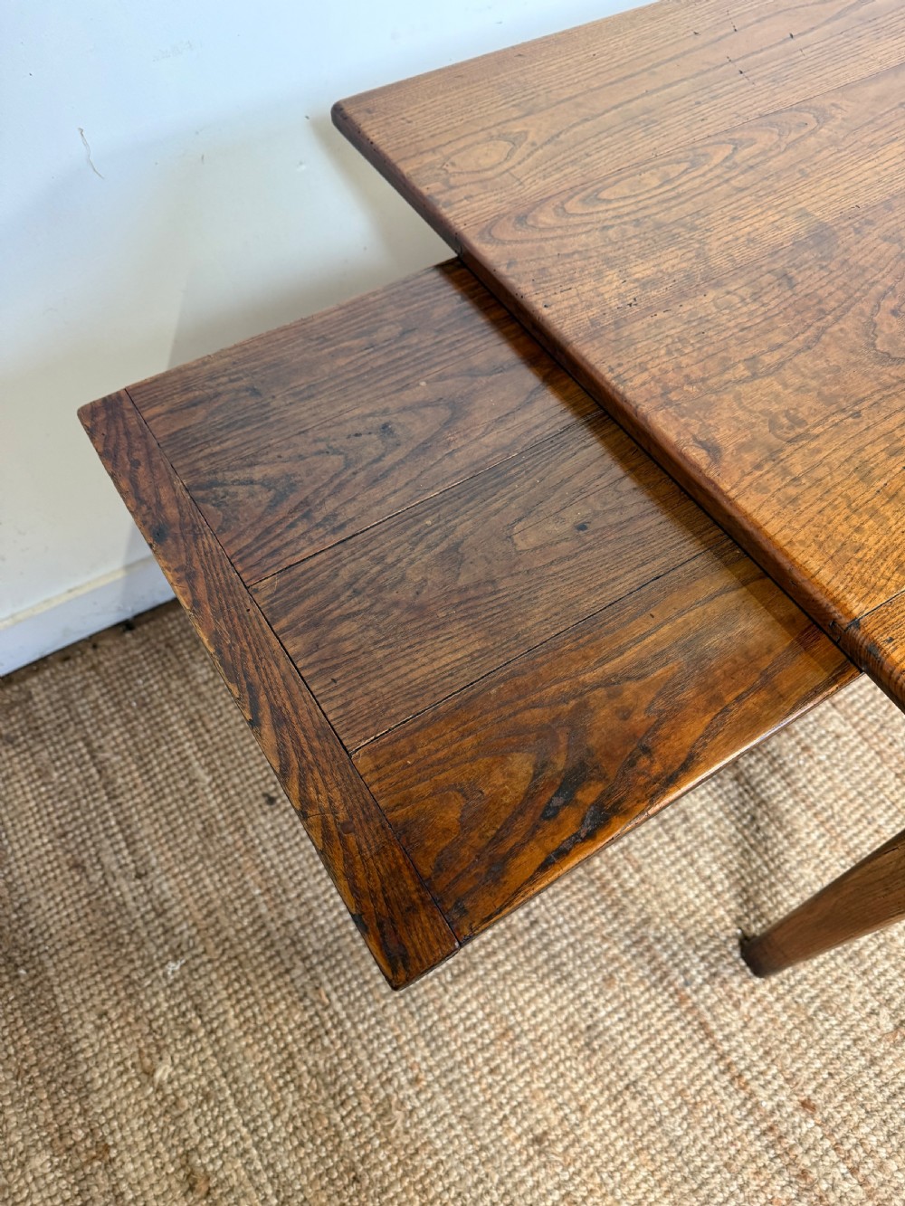 A rectangular late 19th-century chestnut farmhouse table featuring a plank top and four straight tapered legs. View IX
