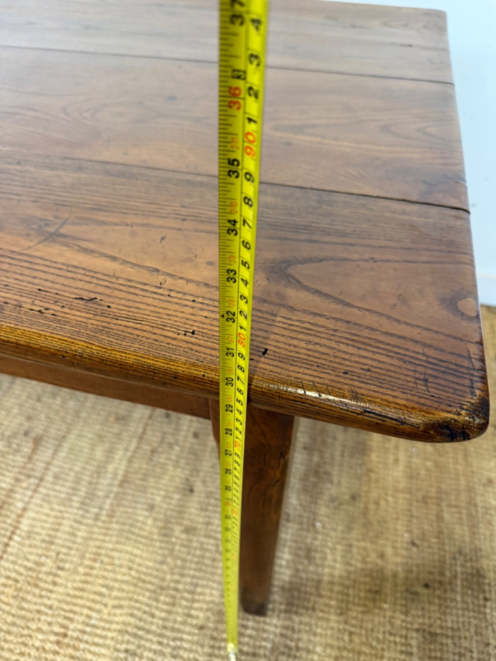 A rectangular late 19th-century chestnut farmhouse table featuring a plank top and four straight tapered legs. View XIII