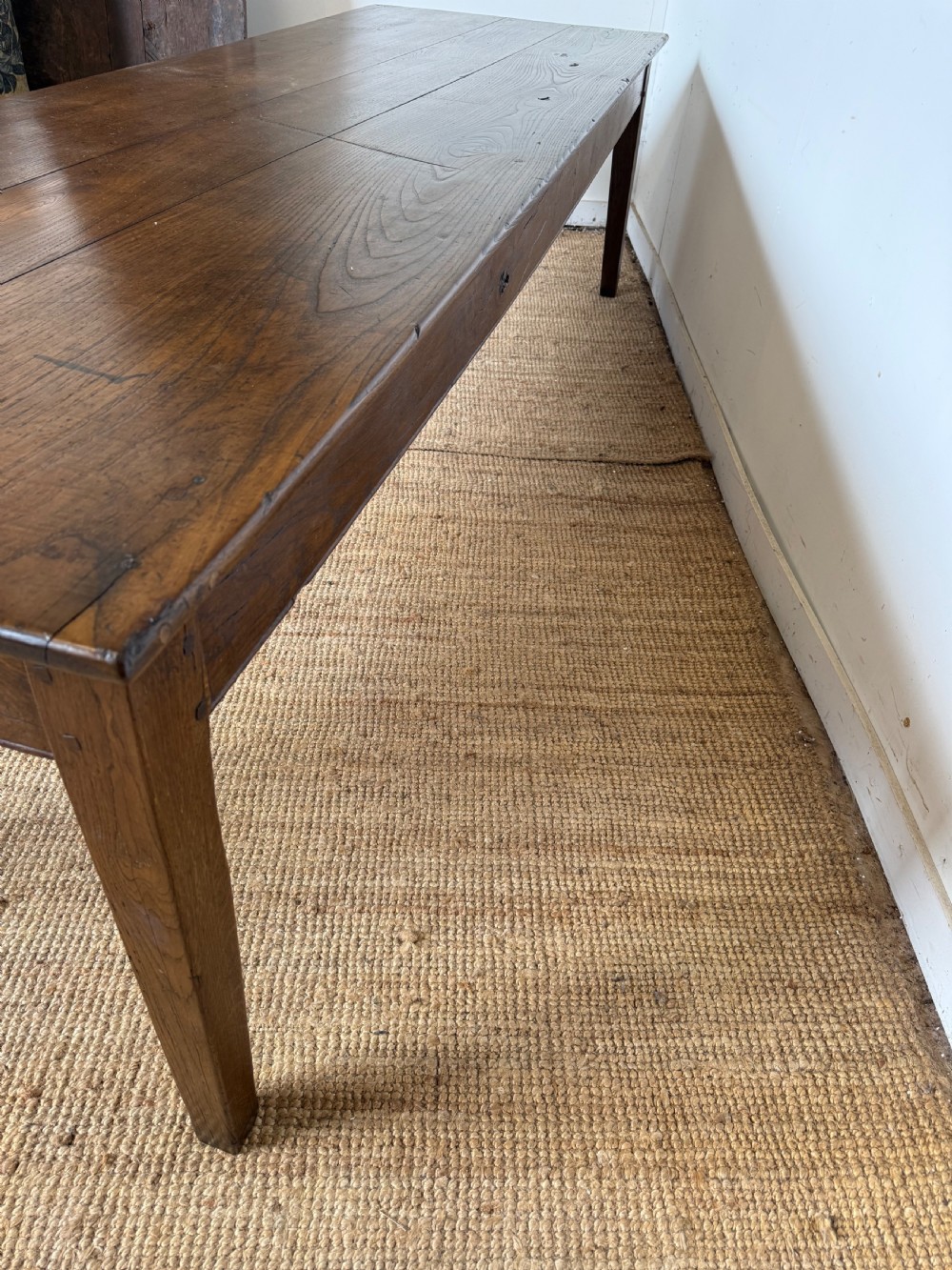 A three metre long antique oak farmhouse table featuring a three-plank top and straight tapered square legs. View XI