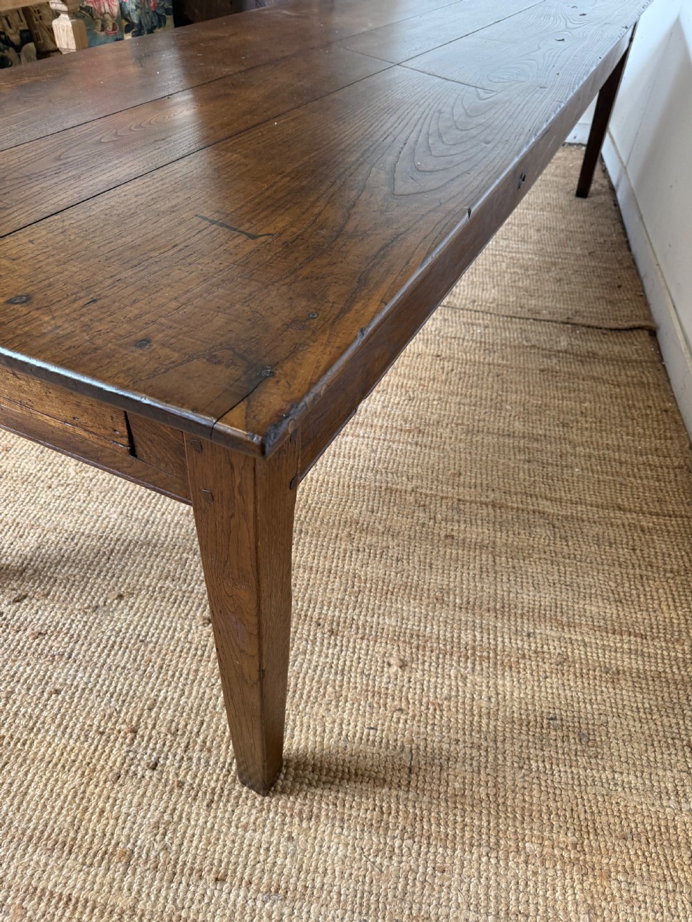 A three metre long antique oak farmhouse table featuring a three-plank top and straight tapered square legs. View XII