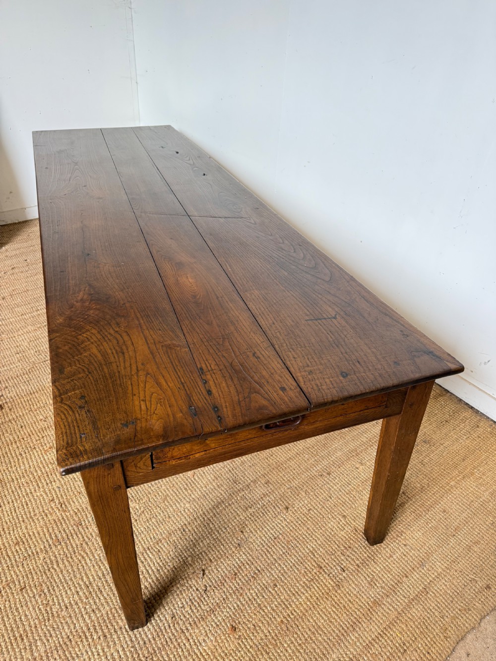 A three metre long antique oak farmhouse table featuring a three-plank top and straight tapered square legs. View XIII