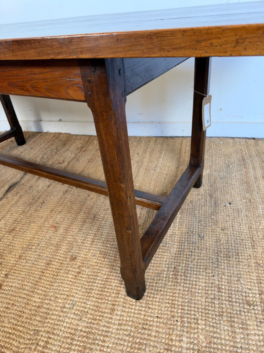 A rustic rectangular cherrywood farmhouse dining table with a three-plank top and an H-stretcher base. View VIII