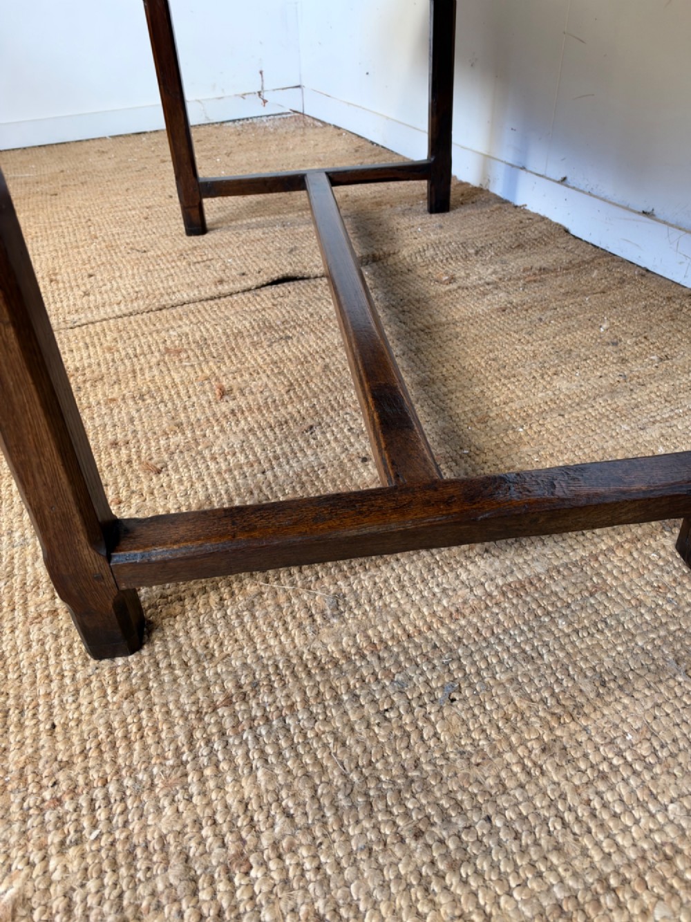 A rustic rectangular cherrywood farmhouse dining table with a three-plank top and an H-stretcher base. View XI