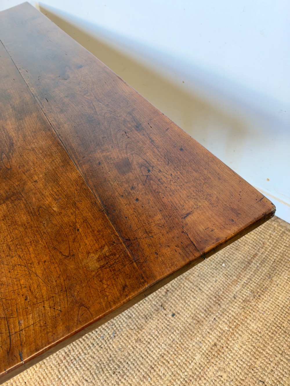 A rustic rectangular cherrywood farmhouse dining table with a three-plank top and an H-stretcher base. View XII