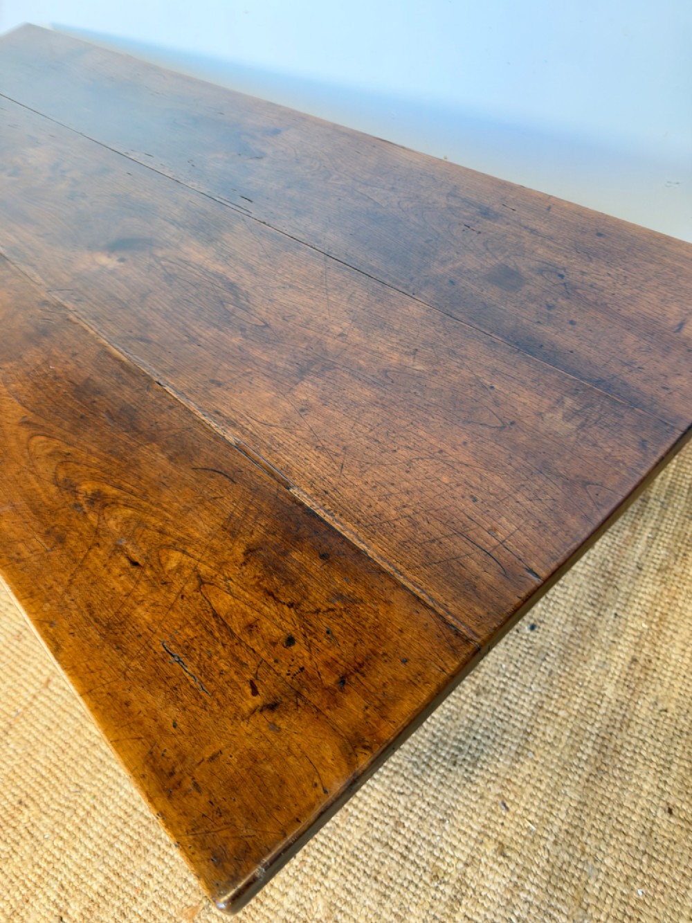 A rustic rectangular cherrywood farmhouse dining table with a three-plank top and an H-stretcher base. View XIII
