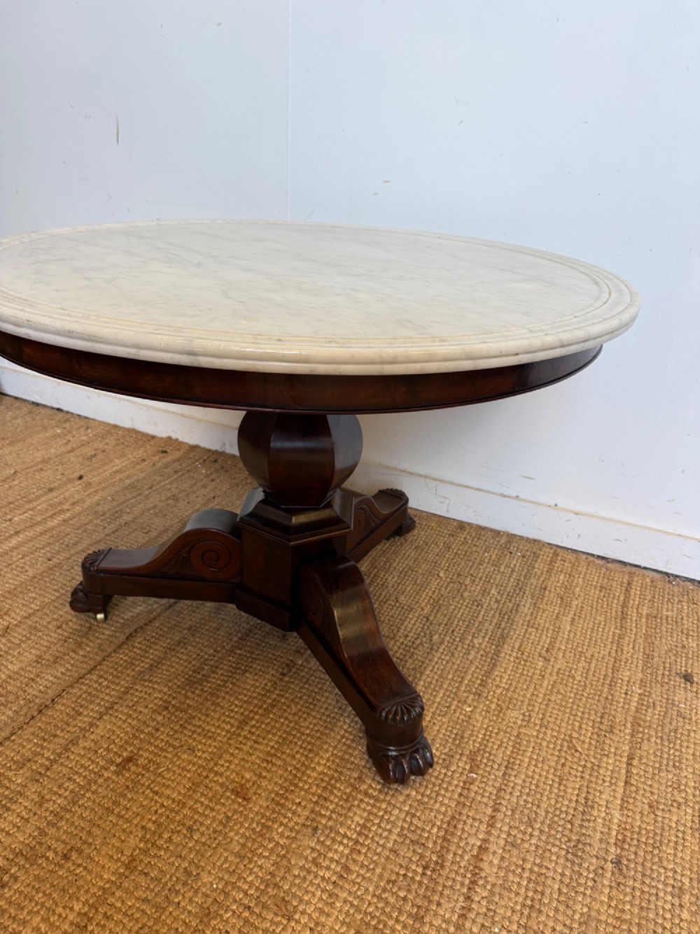 A 19th-century circular centre table featuring a white marble top set on a dark mahogany turned pedestal with a scroll-footed tripod base. View III