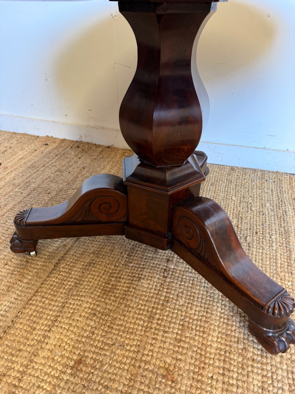 A 19th-century circular centre table featuring a white marble top set on a dark mahogany turned pedestal with a scroll-footed tripod base. View V