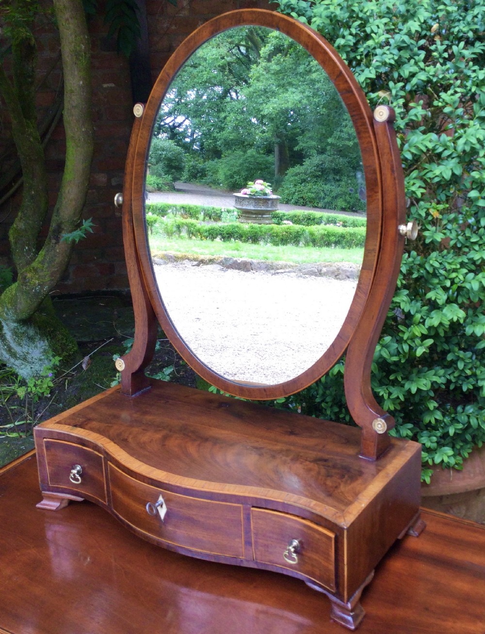 Oval toilet mirror