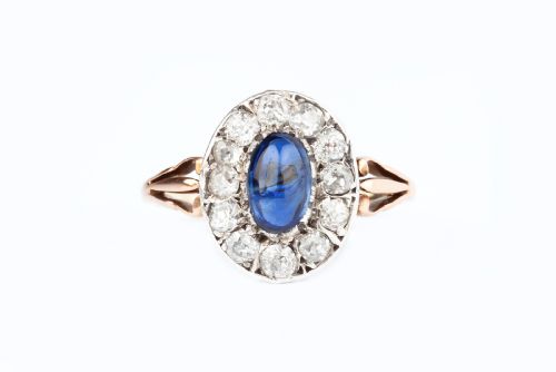 a natural unheated cabochon sapphire and diamond ring - CATEGORY: ANTIQUE JEWELLERY - DATED EDWARDIAN