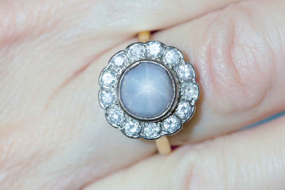 An Early 20th Centruy Natural Star Sapphire and Diamond Dress Ring