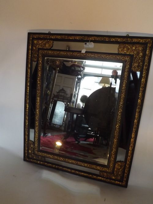 C19th Flemish Ebonised and Gilt-brass Mounted Frame 'Cushion' Mirror.