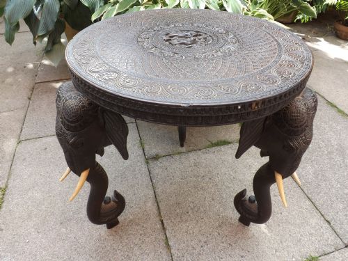 C19th Indian Finely Carved Teak Circular Occasional Table on Elephant Trunk Supports.