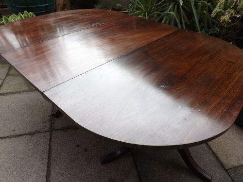 fig 1. Late C18th George III period mahogany twin-pillar dining table.