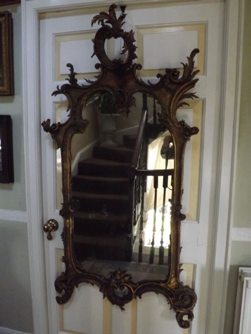 fig 1. C18th Italian carved gilt-wood framed rococo-style mirror of rococo design .