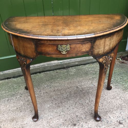fig 1. Early C20th walnut demi-lune side table in the early Georgian period style.