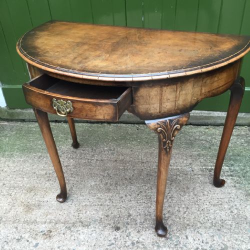 fig 2. Early C20th walnut demi-lune side table in the early Georgian period style.