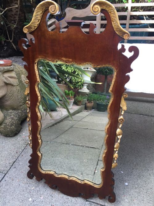 fig 1. C19th George II revival style mahogany and parcel-gilt fret carved mirror.