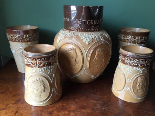 fig 1. C19th suite of Doulton Lambeth commemorative stoneware salt-glaze jug and drinking vessels.
