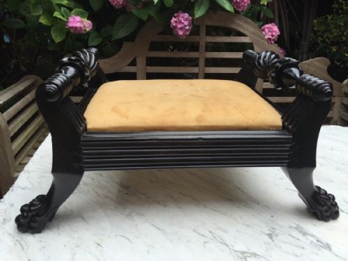 fig 1. Mid C19th Anglo-Indian Ceylanese carved ebony foot-stool of scroll-ended form .