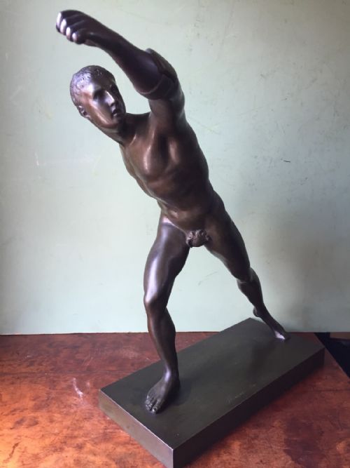 fig 1. A nineteenth-century dark brown patinated bronze study depicting the Borghese Gladiator posed dynamically on an integral rectangular base.