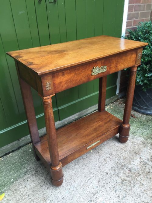 fig 1. Early C19th French Empire-style walnut and fruitwood console table with gilded brass classical-style mounts.