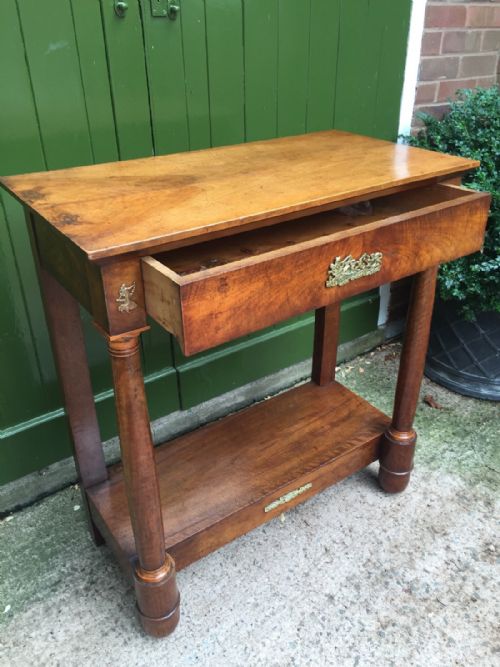fig 2. Early C19th French Empire-style walnut and fruitwood console table with gilded brass classical-style mounts.