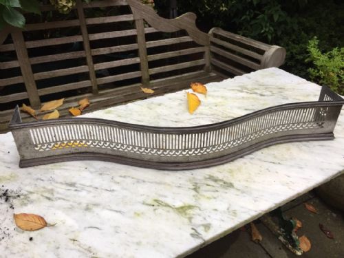 Small Late C18th George III Period Cut and Polished Steel Fire-place Fender of Serpentine Outline.