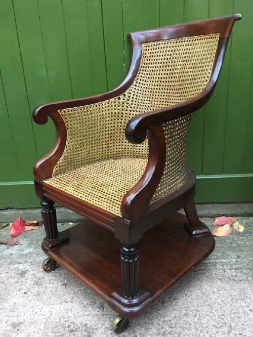 Early C19th George IV Period Mahogany Framed Gentlemans Bergere Library or Desk Armchair of Rare Form .