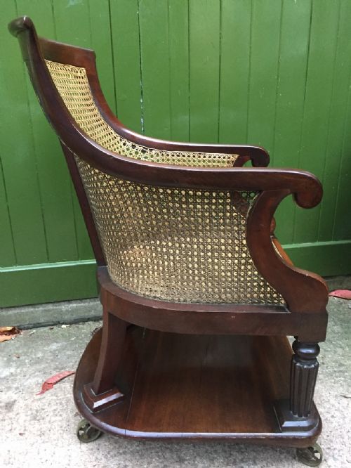 fig 2. Early C19th George IV period mahogany framed gentlemans bergere library or desk armchair of rare form .