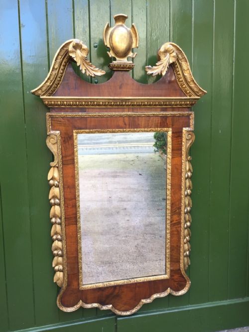 C18th George II Period Walnut and Carved 'Parcel' Gilt Framed Mirror of Palladian Design .