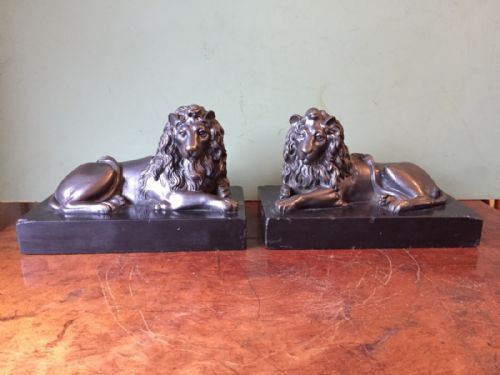 Pair of Mid-c19th French Bronze Lions on Original Black Marble Plinth Bases.