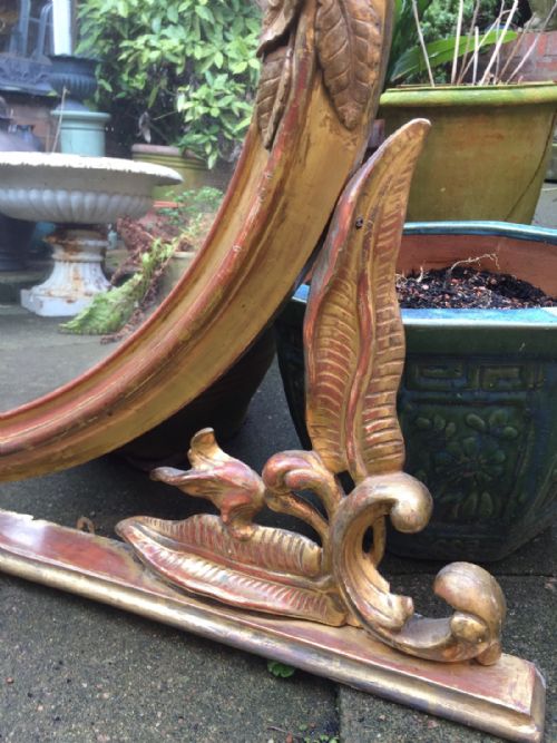 fig 2. Mid C19th carved giltwood oval-framed overmantel mirror with unusual carved fern motif decoration.