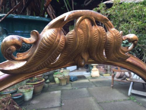 fig 3. Mid C19th carved giltwood oval-framed overmantel mirror with unusual carved fern motif decoration.
