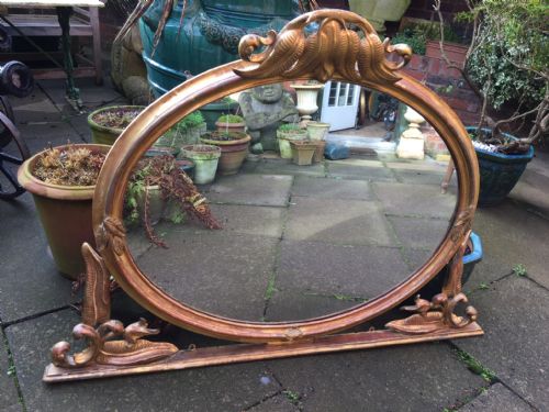 fig 1. Mid C19th carved giltwood oval-framed overmantel mirror with unusual carved fern motif decoration.