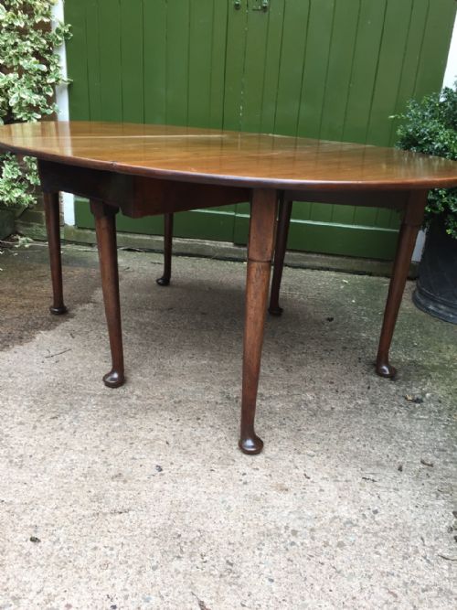 fig 1. C18th George III period mahogany oval drop-leaf dining table .