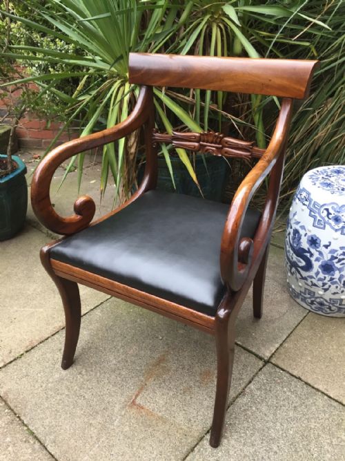 Early C19th Regency Period Mahogany Sabre-leg Scrolled-arm Desk or Library Chair of Broad Proportions.