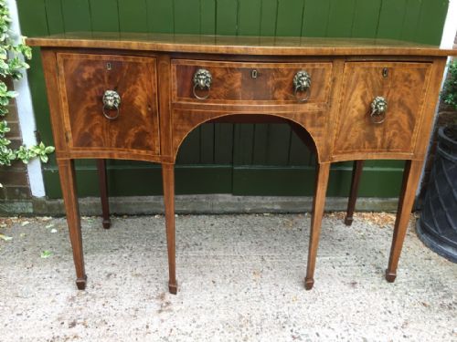 fig 1. Late C18th George III period mahogany sideboard of serpentine outline and elegant compact proportions.