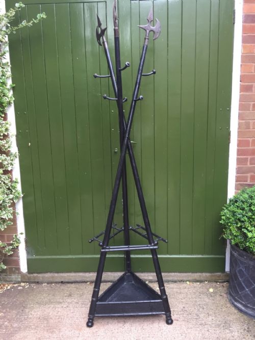 UNUSUAL AND DECORATIVE LATE C19TH FRENCH EBONISED HAT COAT AND STICKSTAND FORMED AS 3 CROSSED HALBERDS OR PIKES - ADDITIONAL PHOTO 1
