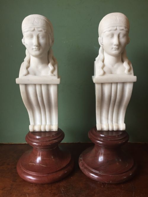 Pair of Early C19th Regency Period Carved Statuary Marble Female Term Figures in the Manner of Thomas Hope, Mounted Upon Rouge Marble Socles.