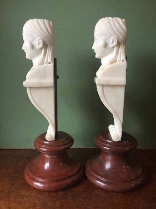 fig 2. Pair of early C19th Regency period carved statuary marble female term figures in the manner of Thomas Hope, mounted upon rouge marble socles.