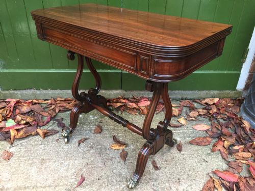 fig 1. Early C19th Regency period mahogany fold-over top tea-table on 'lyre' end supports.