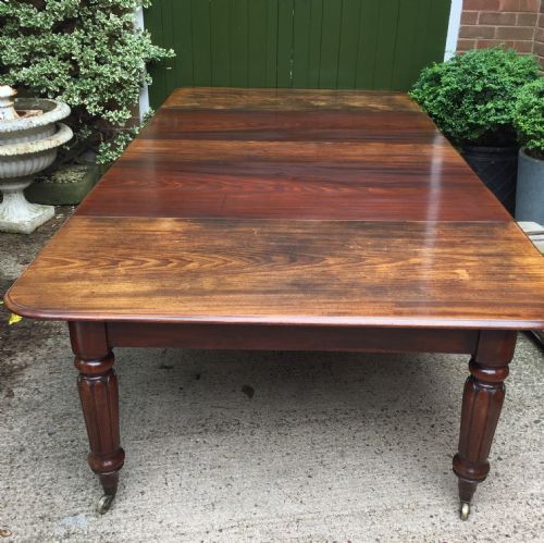 Early C19th Regency Period Mahogany Extending Dining Table with 3 Original Additional Leaves .