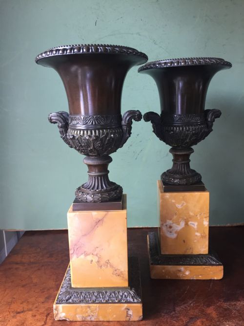 Pair of French Early C19th Charles X Period Bronze Campana Shaped Urns on Siena Marble Plinth Bases.