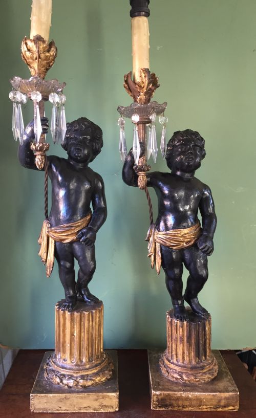 fig 3. Pair of early C19th Italian carved wood amorini or cherubs modelled as lamps raised on truncated fluted column bases.