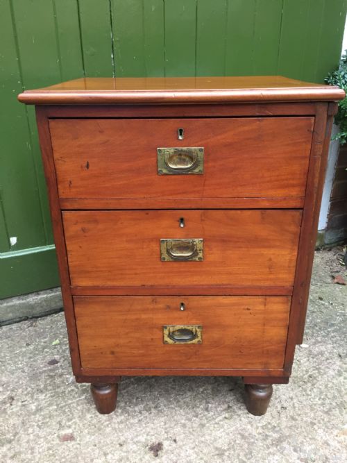 fig 1. C19th mahogany military or naval campaign pedestal chest of drawers with a fold-over flap top .