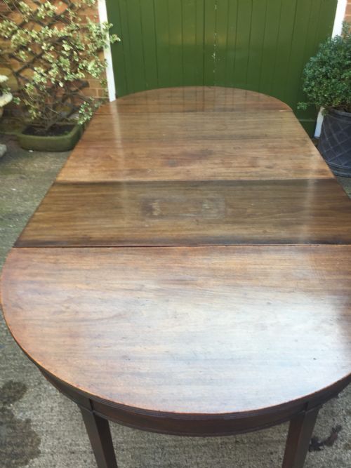 fig 1. Highly versatile C18th George III period mahogany D-ended dining table with various configuration options in 'as found' country-house condition.